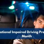 A driver seated behind the wheel at night with blurred police lights in the background, representing National Impaired Driving Prevention Month and road safety awareness.