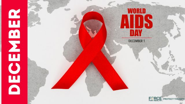 A red awareness ribbon over a world map, symbolizing World AIDS Day and global HIV awareness and prevention efforts.